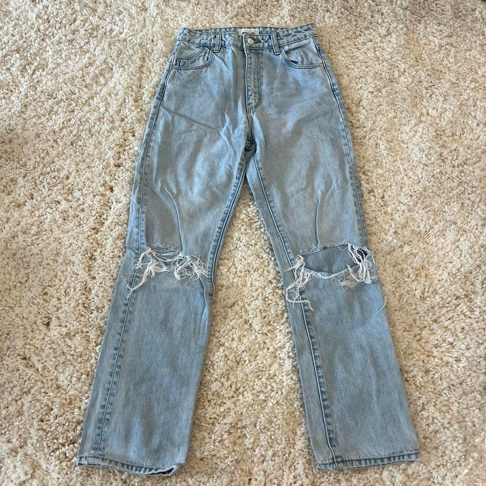 ROLLA’s distressed high rise straight leg jeans.
